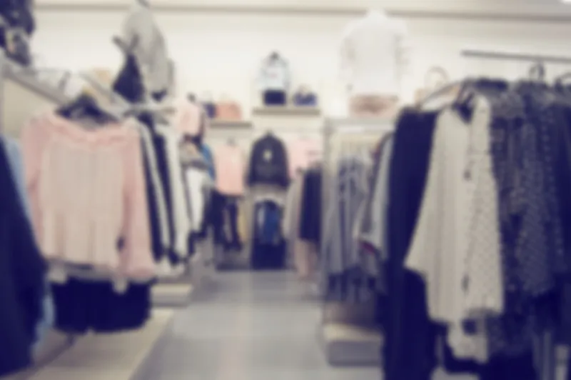 blurred background of clothing store with mannequins