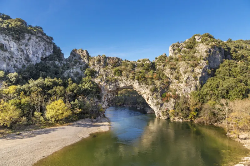 the natural landmark pont dÂ´arc at the gorges de l'ardeche in vallon (france) a famous sightseeing and sports destination for kayaking and swimming