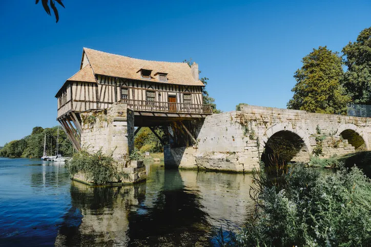 the old mill on the seine river at vernon, normandy, france