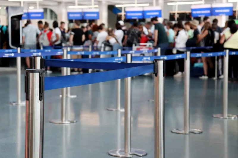 queue of people in the airport building, selective focus passen
