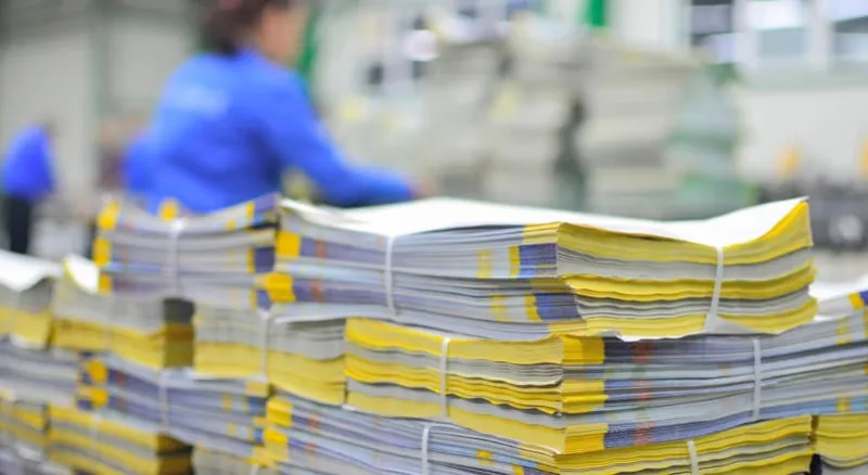 stuck of newspaper magazine in print production process