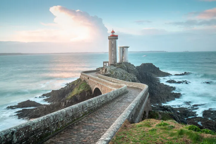 one of the most beautiful lighthouses at sunset phare de petit minou on the coast of brittany, france, europe