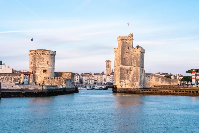 the port of la rochelle during the blue hour panorama of the skyline with its famous towers banner with copy space
