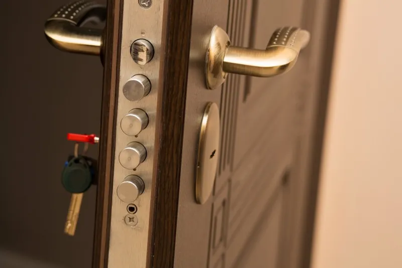 closeup shot of modern door lock with a key space for text
