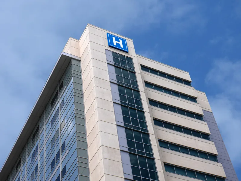 building with large h sign for hospital