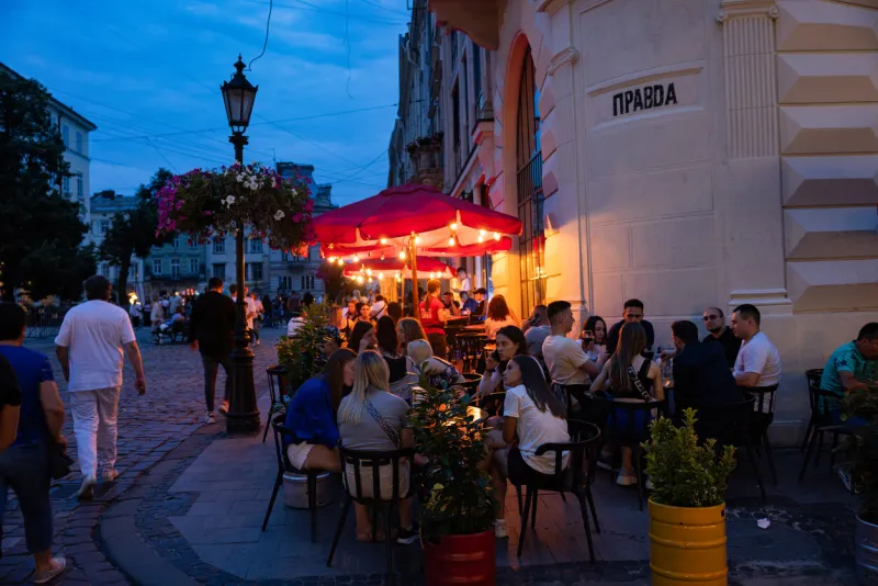 lviv, ukraine - july 12, 2023  people in lviv outdoor restaurant pravda beer theatre