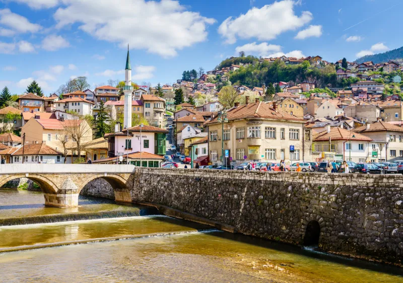 sarajevo, bosnia-herzegovina, april 9, 2017  miljacka river embankment in sarajevo city center on a sunny spring day