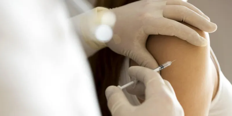 doctor hand make patient insulin flu shot by syringe subcutaneous arm injection vaccination