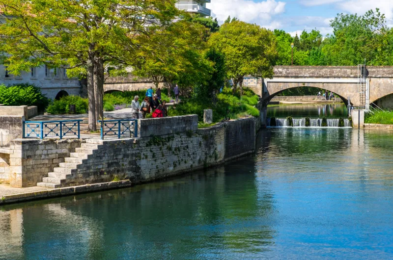 niort, france - may 11, 2019  the quay of sevres river in old town of niort, deux-sevres, france