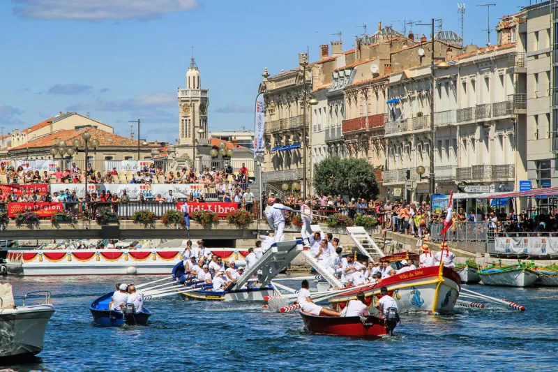 sete, france - august 23, 2014  traditional water jousting performance during stlouis festival at the streets of sete, south of france on august 23