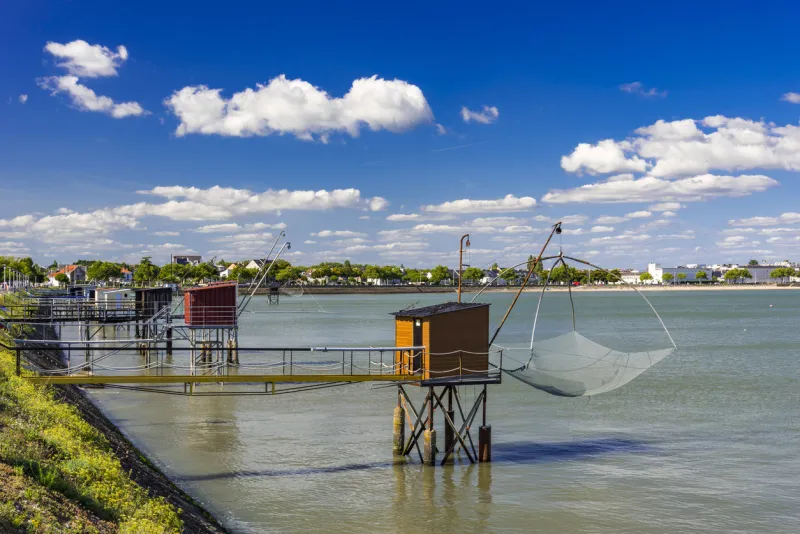 fishing huts and carrelets over the estuary at st nazaire, france