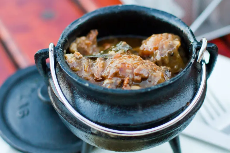 oxtail in a black cast iron pot