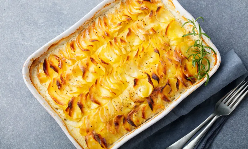 potato gratin, backed potato slices with creamy sauce top view