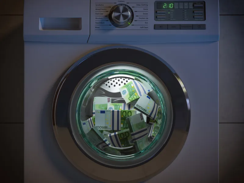 dirty money laundering concept euro packs laundering in washing machine under clioud of night 3d illustration