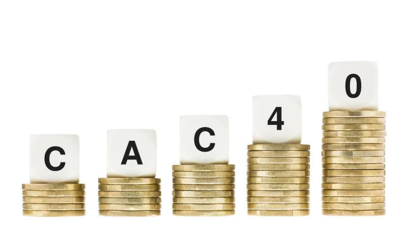 cac 40 (paris stock exchange share index) on gold coin stacks isolated on white