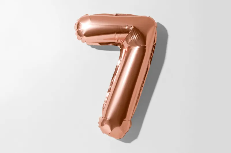 number 7, rose gold foil balloon number seven isolated on a white background with clipping path