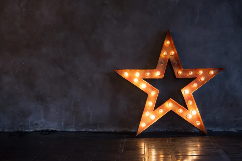 decorative star with lamps on a background of wall modern grungy interior