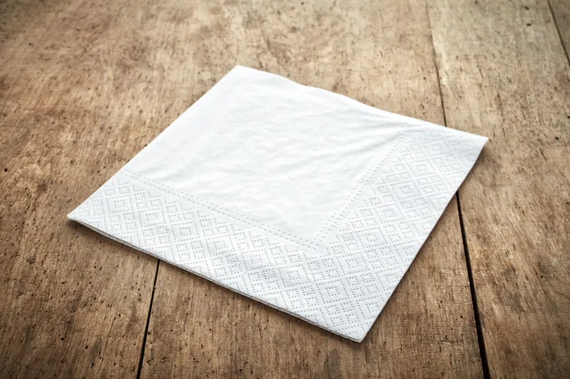 white paper napkin on old wooden table