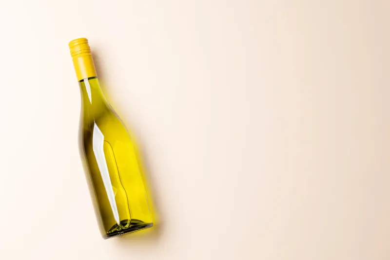 white wine bottle flat lay with copy space