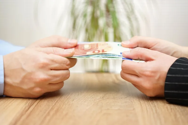 man and woman are fighting over money