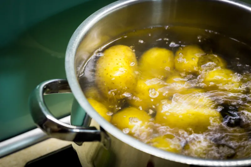 cooked potatoes in a pot, close up