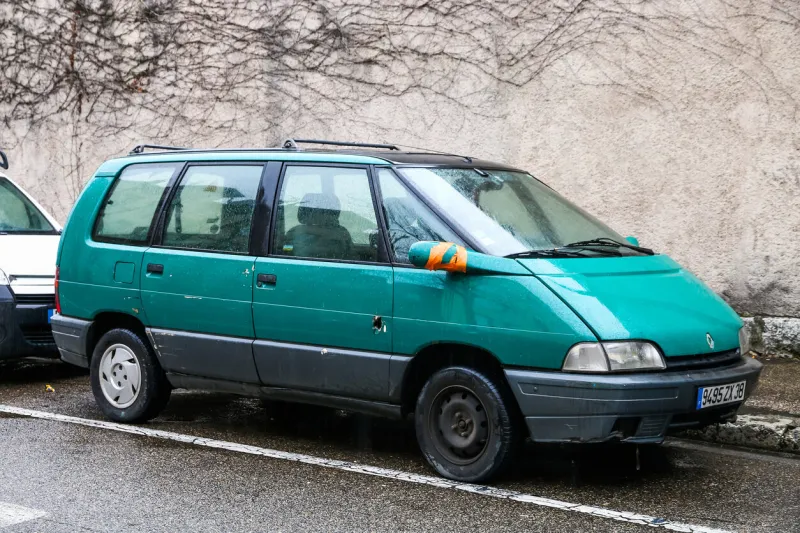 grenoble, france - march 14, 2019  green van renault espace in the city street