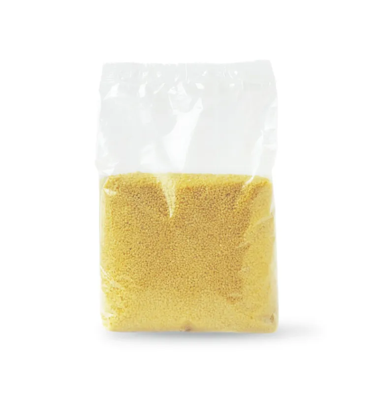 couscous grains in a transparent package isolated on a white background