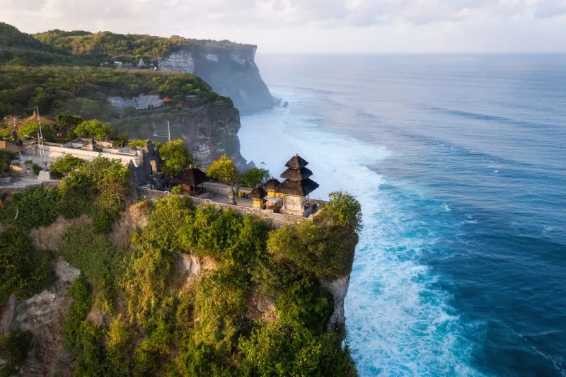 bali, indonesia, aerial view of pura luhur uluwatu temple at sunrise