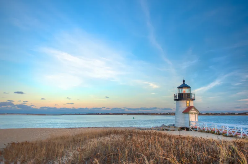 landscape image taken from shore on a desolate day at brant point in nantucket ma