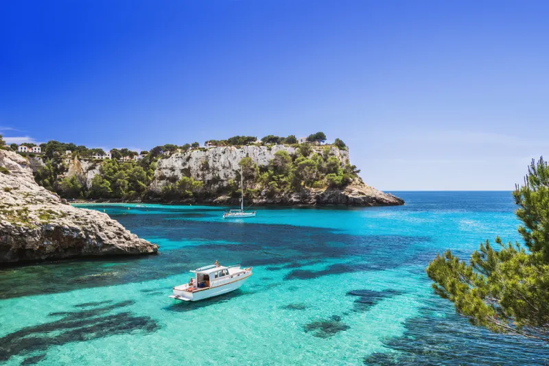 beautiful bay with sailing byachts, cala galdana, menorca island, spain