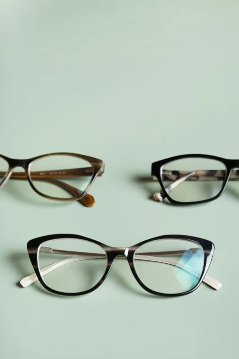 stylish eyeglasses on colored background optical store, vision test, stylish glasses concept