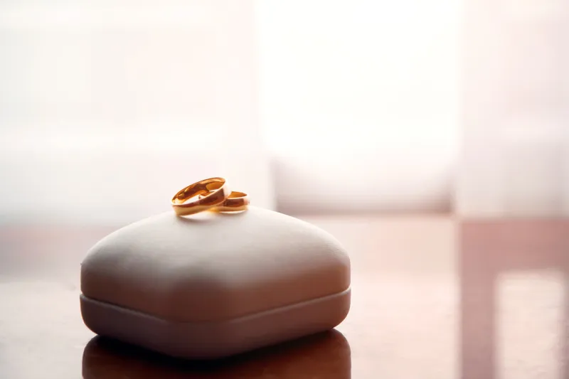 wedding gold rings lie on a box
