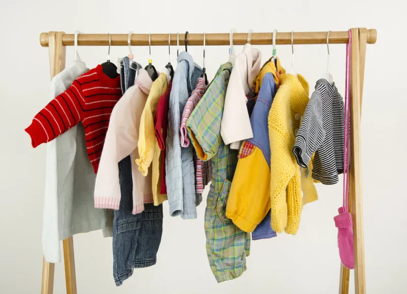 colorful wardrobe of newborn,kids, babies full of all clothes, accessories