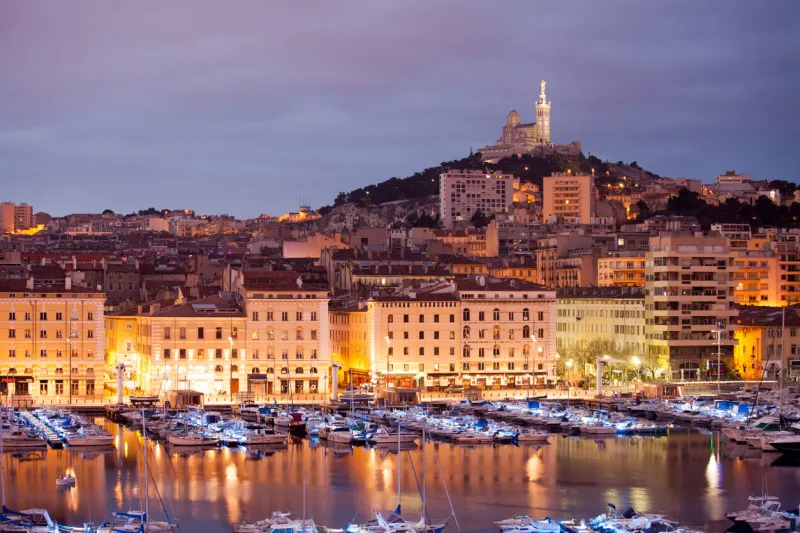 france, marseilles, 16th february - 2014 photo of marseille at the evening you can see old port, historical part of the city and the notre dame de la garde basilica
