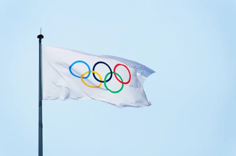 london, uk - circa july 2012  olympic flag against blue sky background during london 2012 olympic games