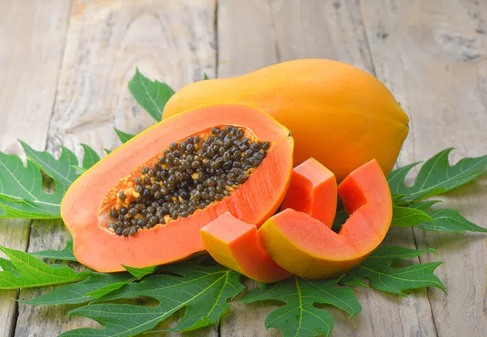 papaya on wooden background