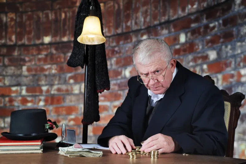 a grumpy old man scowling at the viewer as he counts his gold coins by a stack of large bills