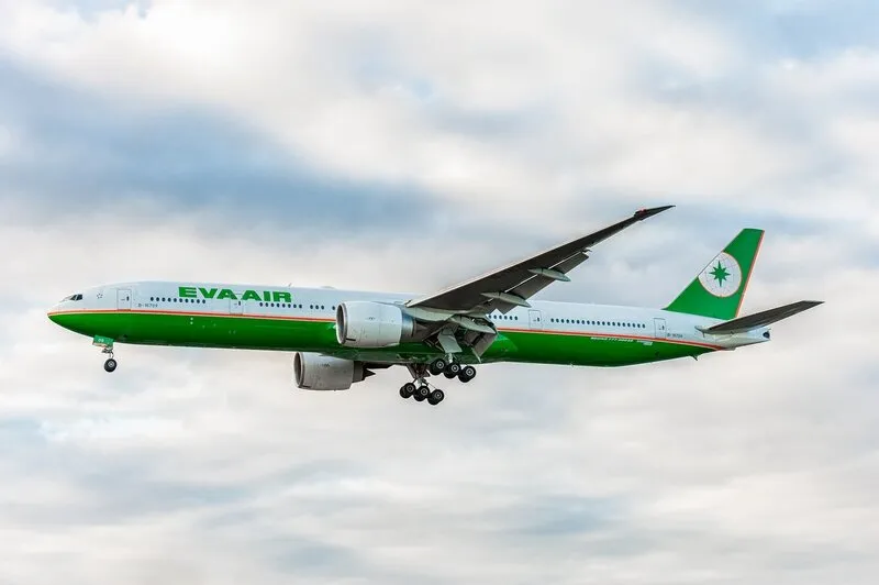 london, united kingdom - august 22, 2016  b-16709 eva air boeing 777 landing in london heathrow international airport england