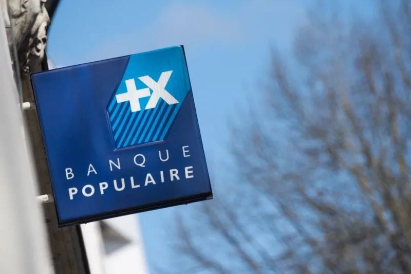 a picture taken on march 25, 2021 shows the sign of french banj banque populaire on a shop in the centre of nantes, western france (photo by loic venance   afp)
