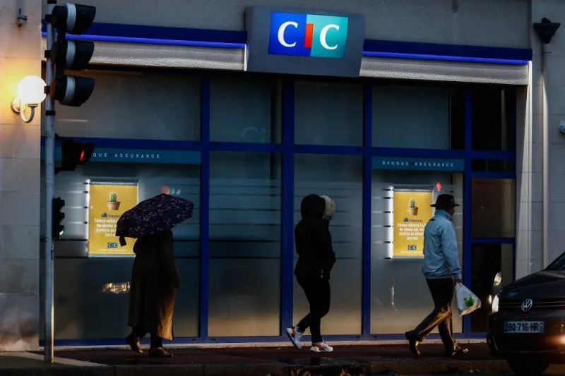 people walk in front of a credit industriel et commercial (cic) bank in ouistreham, normandy, northwestern france, on october 28, 2019 (photo by sameer al-doumy   afp)