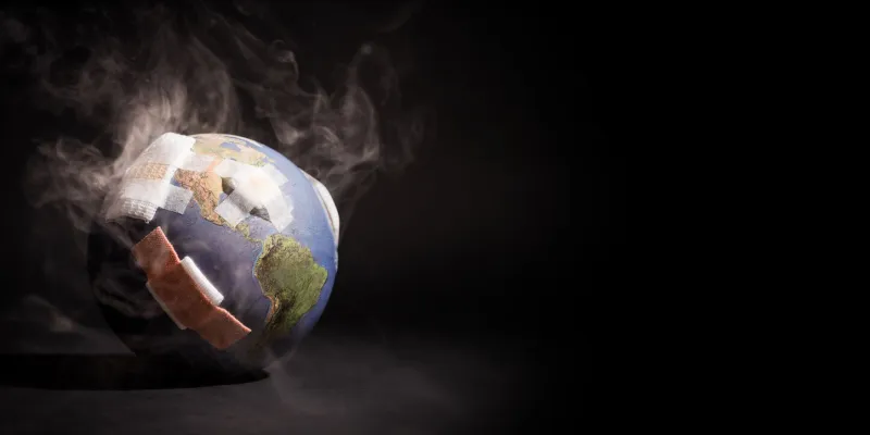 white smoke cover around the globe (world) full of bandages, demonstrating impact of global warming, climate change, pollution from fossil fuels burning, deforestation, industrial revolution