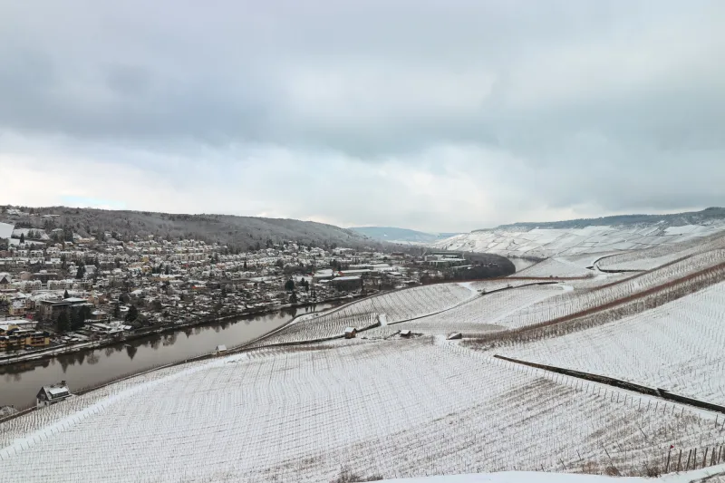 enchanting aerial scenic view of the mosel valley and the town of bernkastel-kues germany covered in snow during winter
