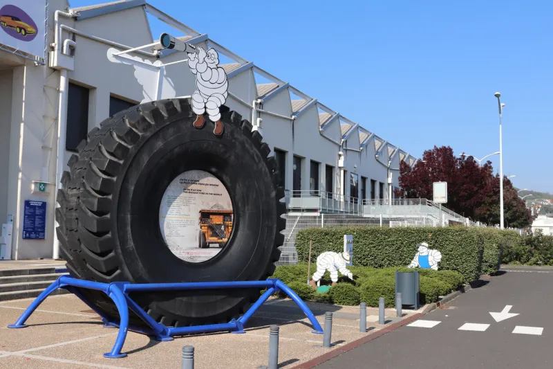the bibendum, michelin logo, sitting on a big tire, in front of the michelin museum, city of clermont ferrand, puy de dome department, france