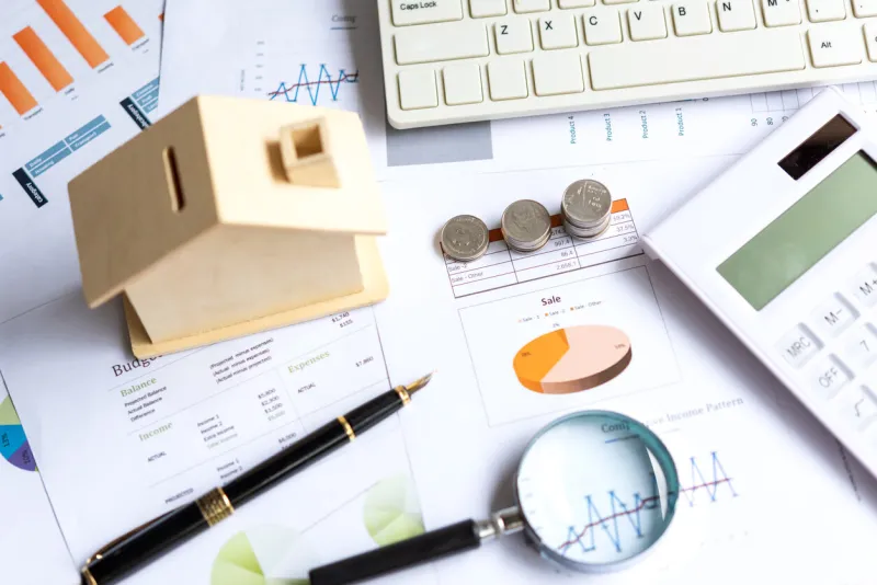 the money coin growing stack for saving and investment after retirement and elderly saving for investment real estate home  business newspaper with financial report on desk city background