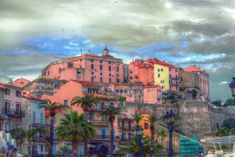 multi-colored picture of the old town of ajaccio under a cloud space, capital city of corsica