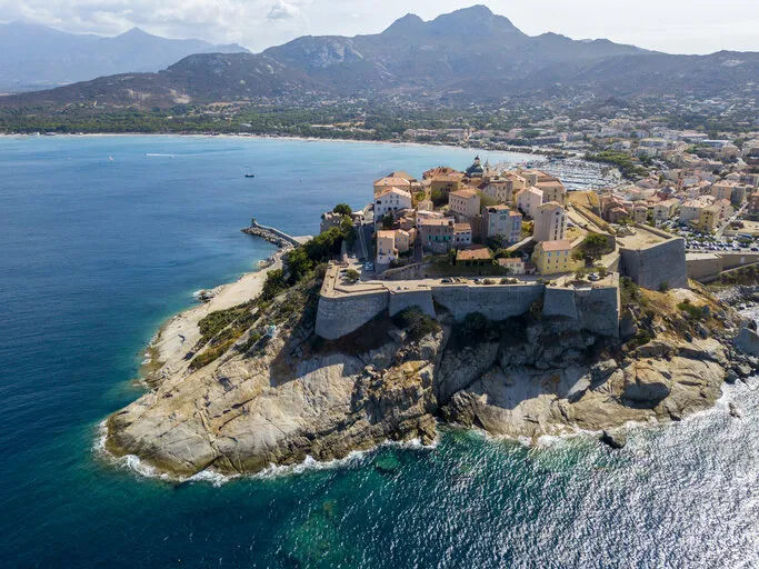 aerial view of calvi city, corsica, france walls of the city, cliff overlooking the sea