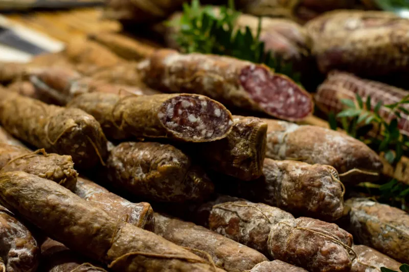 italian salami and bacon, cured meat with bay leaf herbs, traditional italian cured meat