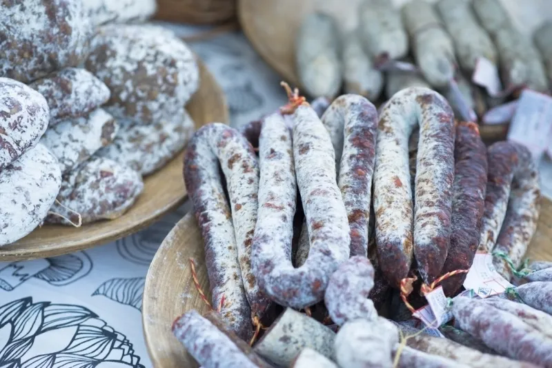 dry salami and sausages at grocer’s store