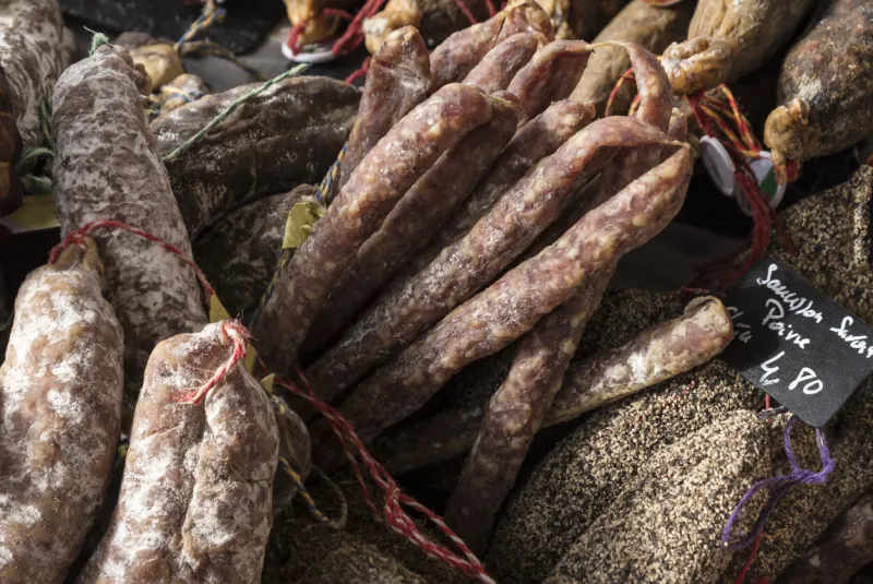 delicious traditional sausages and salami in french market in paris, france