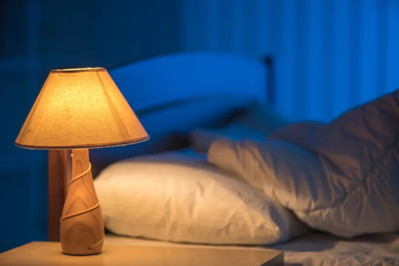 the lamp against the background of the bed night time